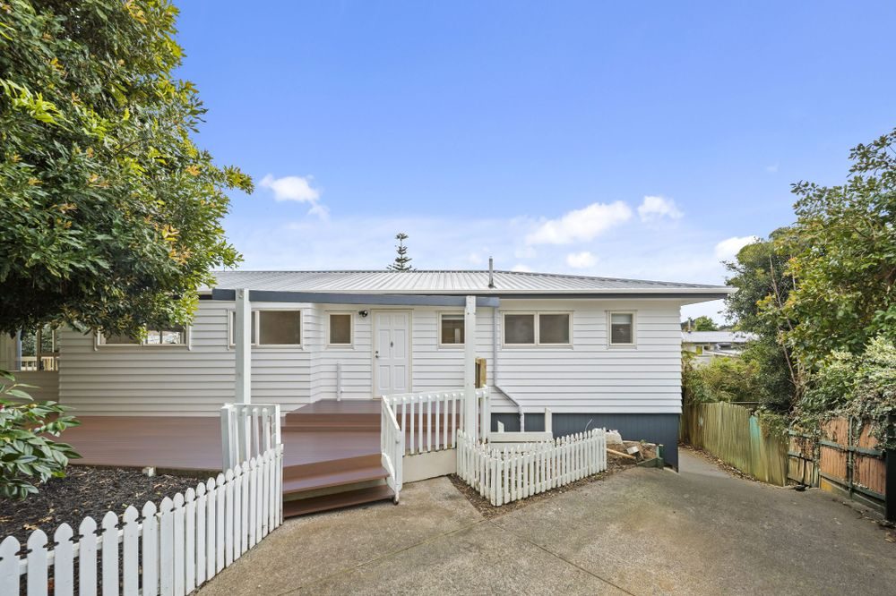 Reclad project: new white weatherboards, deck and picket fence, Christchurch