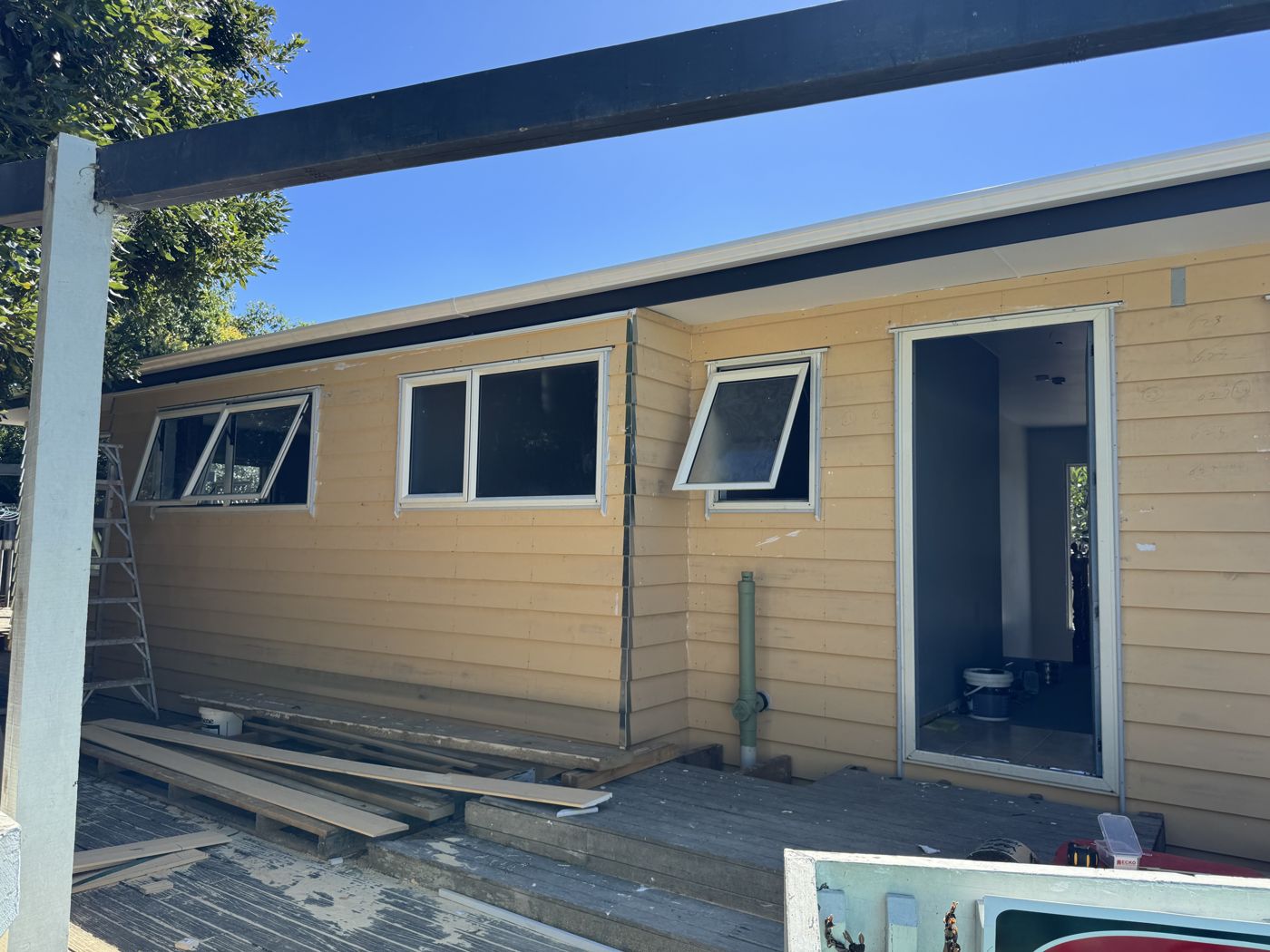 New weatherboard cladding being installed