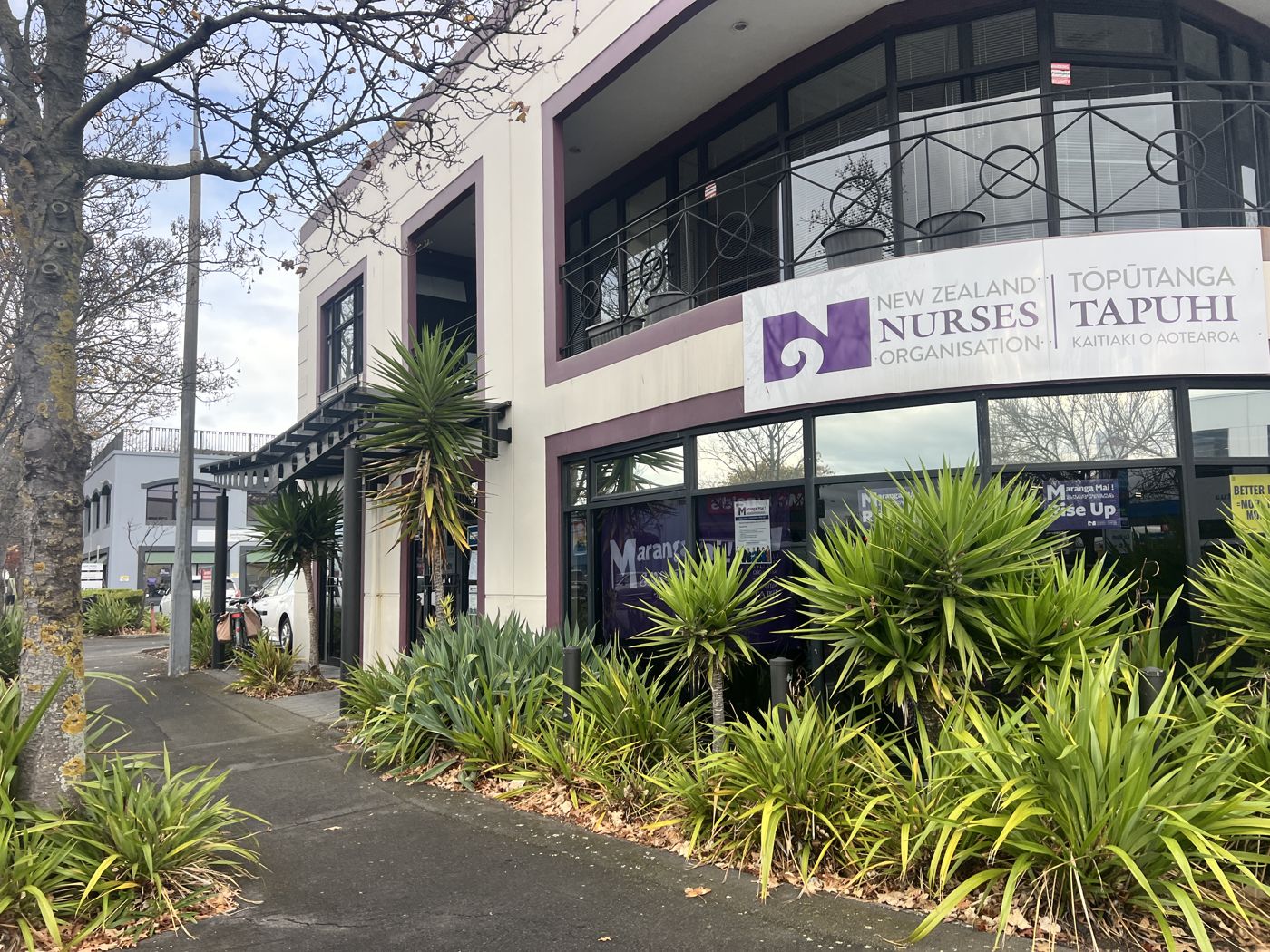 Commercial building frontage before repair and repaint