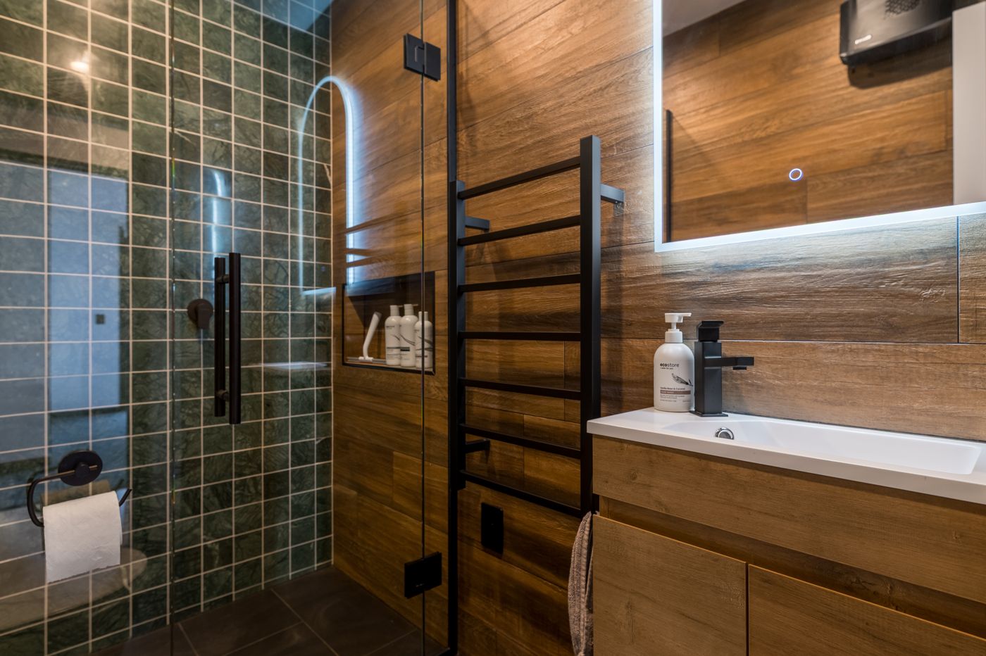Renovated bathroom with green tiled shower and timber-look walls, Christchurch